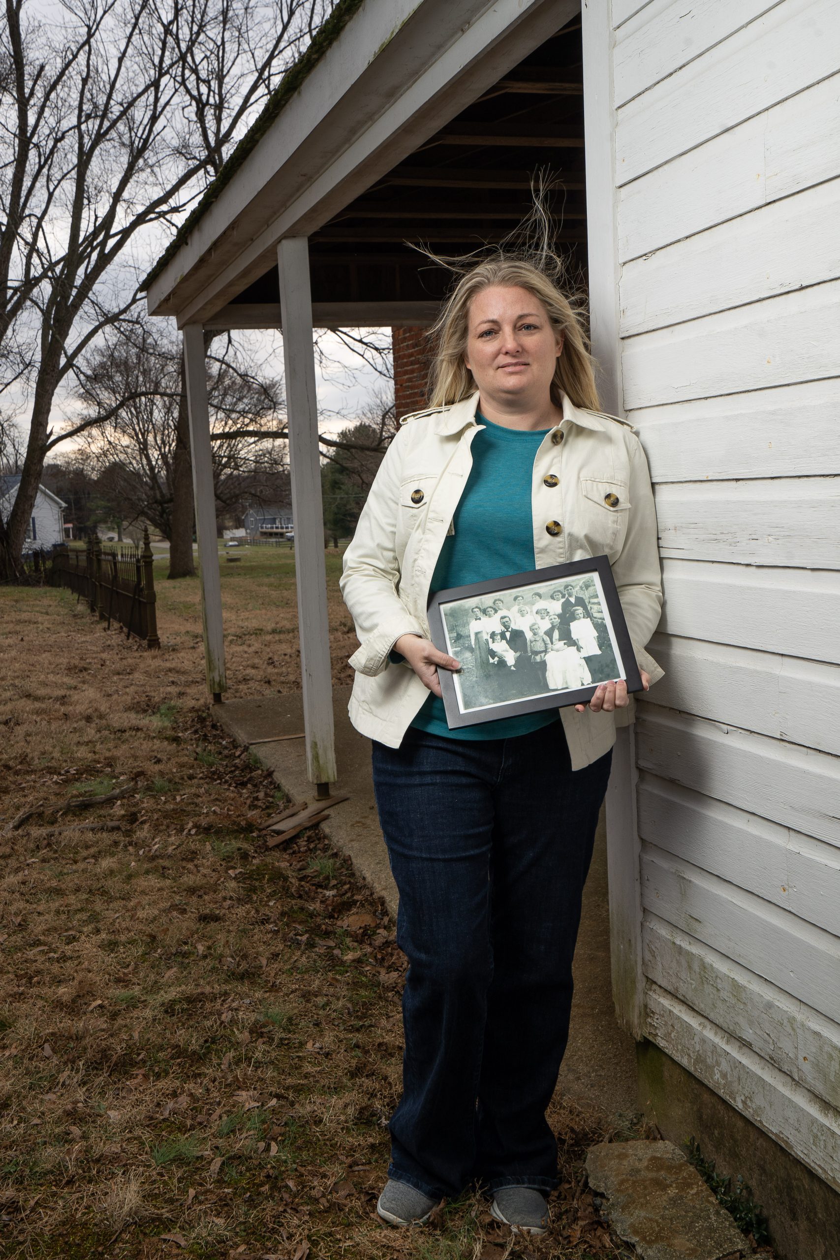 Elizabeth Young Flahart holding a picture of her great-grandmother’s family at West Nottingham Brick Meeting